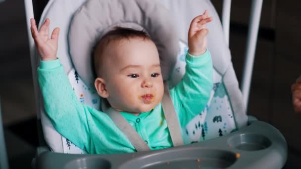 Active Healthy Caucasian Boy Being Fed Spoon Cute Child Sits — Stock Video
