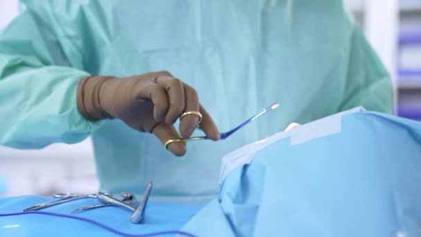 Gloved Hands Unrecognized Surgeon Using Metal Instrument Sewing Patient End — Stock Video