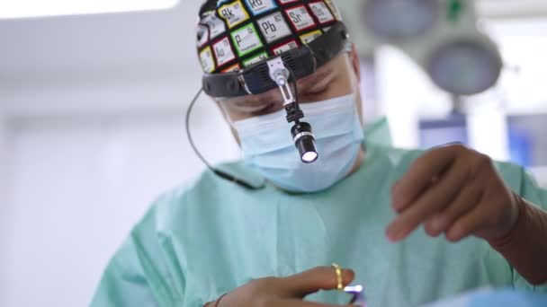 Serious Confident Surgeon Colorful Mask Device Glasses Sews Patient Portrait — Stock Video