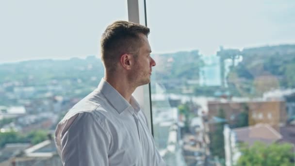 Thoughtful Mid Aged Man Stands Leaning Panoramic Window Man Puts — Stock Video