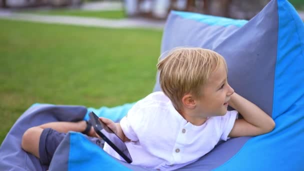 Young Caucasian Boy Resting Outdoors Bag Chair Phone Lovely Kid — Stock Video