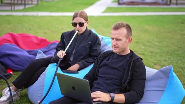 Mid Aged Young Couple Bean Bag Chairs Resting Outdoors Male — Stock Video