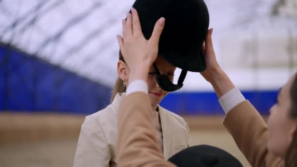 Loving Mom Puts Carefully Jockey Helmet Her Daughter Head Lovely — Stock Video