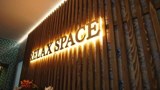 Signboard Wall Beautiful Golden Letters Lit Brightly Name Brand Spa — Stock Video