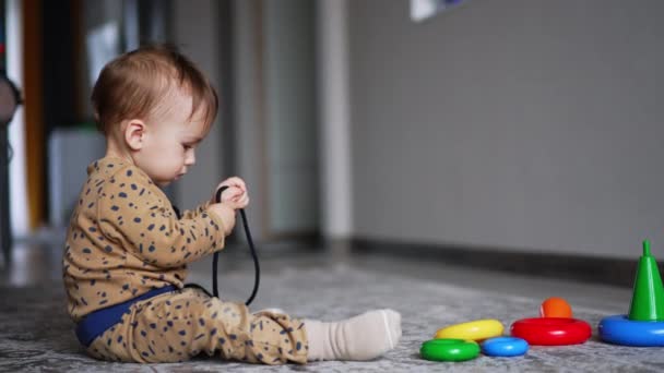 Cute One Year Old Boy Sits Floor Playing Cord Funny — Stock Video