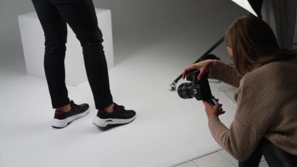 Lady Taking Shot Male Feet New Modern Black Sneakers White — Stock Video