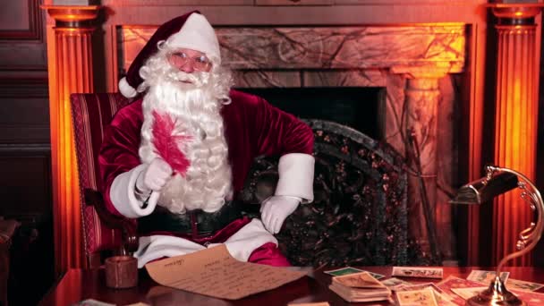 Santa Claus Sitting Indoors Front Fire Place Santa Writing Letter — Stock Video