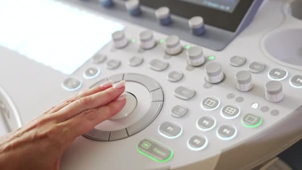 Female Medic Hand Turning Handles Medical Equipment Close Ultrasound Machine — Stock Video