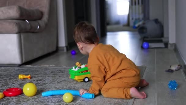 Toddler Boy Plays Room Little Cute Child Crawls Floor Scattered — Stock Video