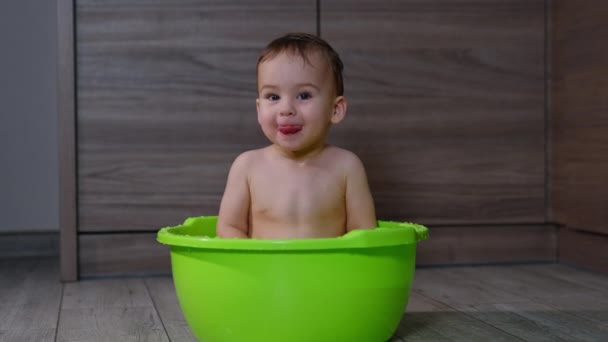 Adorable Caucasian Baby Boy Sitting Washbowl Lovely Kid Shows Tongue — Stock Video
