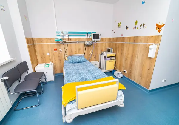 Modern recovery hospital room. Clinic equipment with comfortable bed.