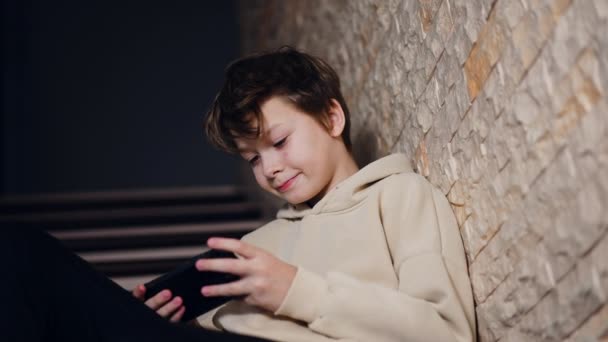 Brunet Teenage Boy Focused Game His Phone Kid Sits Stairs — Stock Video