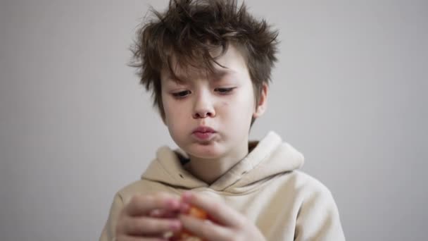 Brunet Teenager Messy Hair Eating Tangerine Kid Enjoys Fruit Chewing — Stock Video