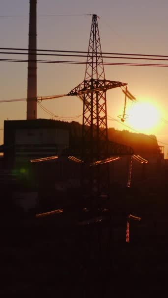 Silhouette Transmission Line Sunset Steel Voltage Electric Tower Factory Background — Stock Video