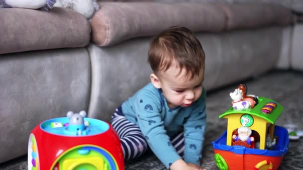 Dark Haired Caucasian Toddler Boy Sitting Floor Next Sofa Adorable — Stock Video
