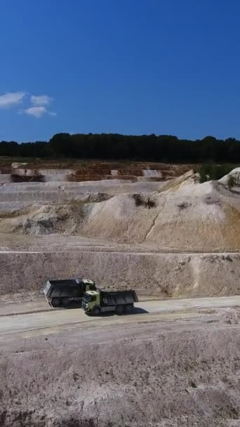 Two Trucks Meeting Road White Clay Quarry Hilly White Landscape — Stock Video