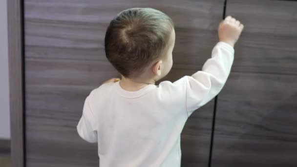 Cute Toddler White Sweatshirt Walks Kitchen Eating Cookie Kid Comes — Stock Video
