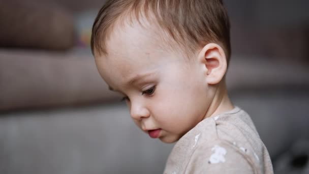 Beautiful Caucasian Baby Boy Looking Camera Close Portrait Blurred Backdrop — Stock Video