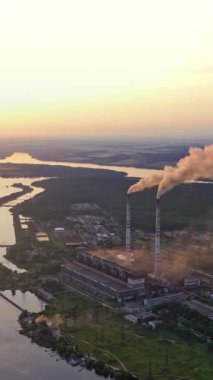 Scenic rural landscape. Aerial view of rural landscape against sunset Vertical video