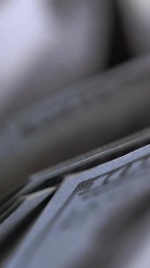 Money counting equipment for paper money calculation. US national paper currency. Automatic mechanism for bank financial operations. Vertical video