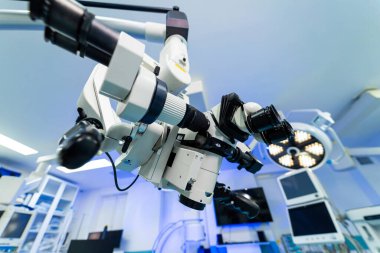 Neurology tools in OR. High-tech surgical equipment is prepared for a neurosurgery procedure in a modern operating room.