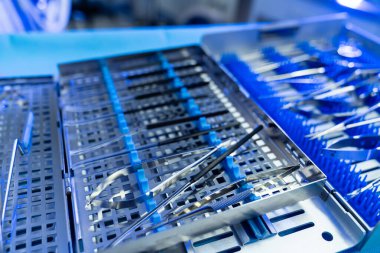 Tools ready for brain surgery. Surgical instruments are meticulously arranged and sanitized in the operating room to assist in neurosurgery.
