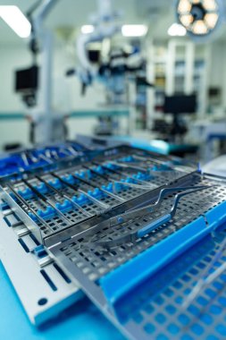 Key neurosurgery tools. Surgical instruments are meticulously arranged in the neurosurgery operating room, ready for the upcoming procedure.