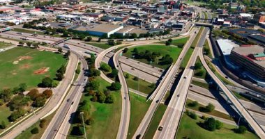 Branched system of roads in the cityscape of Detroit, Michigan, USA. Traffic in modern American city from aerial view.