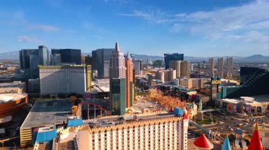Las Vegas, USA, 11 September 2025: Lively cityscape of the modern city at daytime. Hotels and casinos of Las Vegas, Nevada, USA from aerial view. Roller coaster at the territory of New York-New York Hotel and Casino.