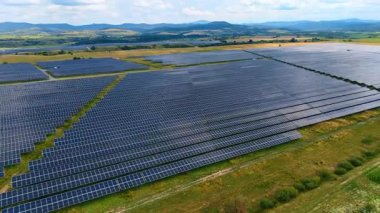 Massive solar panel installation. Endless rows of solar panels capturing sunlight for renewable electricity.