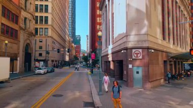 Wide streets of modern lively city. Walk among the high-rises of Pittsburg, Pennsylvania, USA.