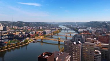 Beautiful cityscape of Pittsburgh, Pennsylvania, United States on sunny day. View on the river crossed by the multiple bridges.