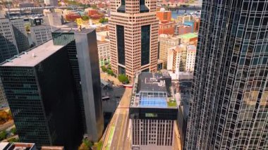 Empty wide-lane street in the downtown of Pittsburgh, Pennsylvania, USA. Drone footage at the faade of One PPG Place skyscraper.
