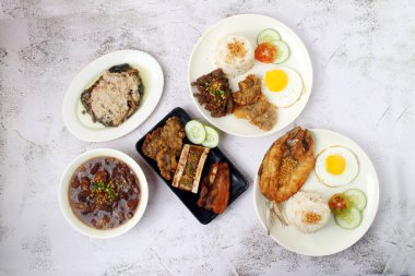 Photo of freshly cooked assorted Filipino food.