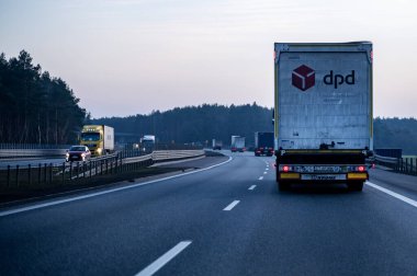 Road transport - car in motion. DPD  leader in parcel delivery. clipart