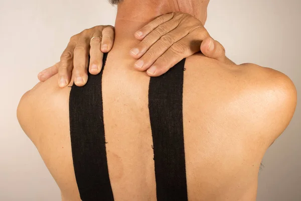 Mature Man Kinesio Tape His Back Pain Management — Stock Photo, Image