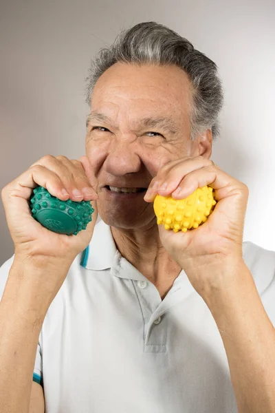 Mature Man Holding Squeezing Massage Therapy Spike Balls — Stock Photo, Image
