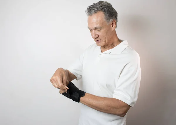 Senior Man Wearing Wrist Brace His Left Hand Wrist Pain — Stock Photo, Image