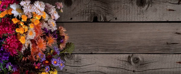 Wild Colorful Rustic Flowers Bouquet from Daisy, Chrysanthemum and Others on Wooden Rustic Table. Mothers Day, Summer and Spring Holidays Wallpaper.