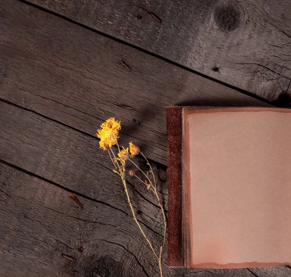 stock image Old Vintage Diary with Blank Paper Sheets and Wild Flowers on Wooden Rustic Table.