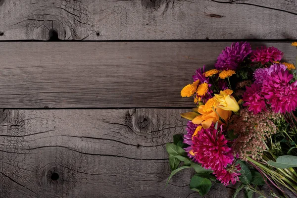 Wild Colorful Rustic Flowers Bouquet from Daisy, Chrysanthemum and Others on Wooden Rustic Table. Mothers Day, Summer and Spring Holidays Wallpaper.