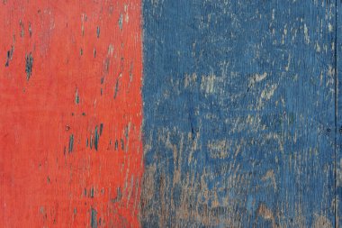 Kırsal kırmızı ve mavi ahşap tahta yıpranmış ve yıpranmış bir doku sergiliyor, klasik bir estetik taşıyor. Yıpranmış, doğal ya da kırsal temaları canlı ve zıt renkte yansıtan tasarımlar veya arka planlar için idealdir..