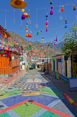 A brightly decorated street in San Juan La Laguna, Guatemala.  clipart