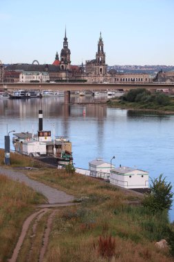 DRESDEN, GERMANY - JULY 06, 2024: view from elbe riverbank over carola bridge towards old city. High quality photo clipart