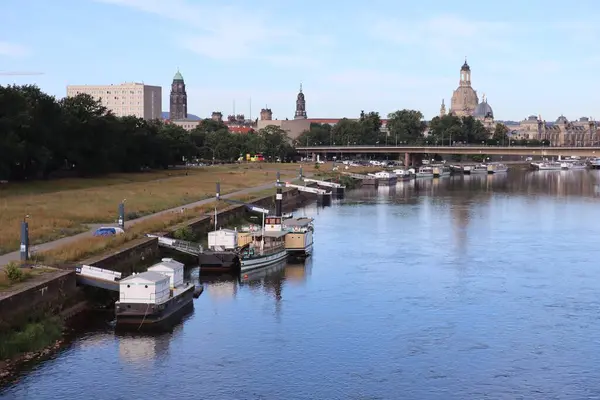 Stock image DRESDEN, GERMANY - JULY 06, 2024: view from elbe riverbank over carola bridge towards old city. High quality photo