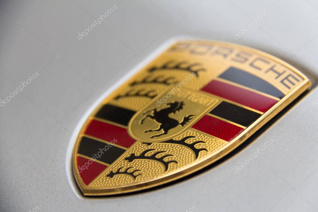 PADUA, ITALY - AUGUST 26, 2013: Porsche logo on silver car with shallow depth of field. High quality photo