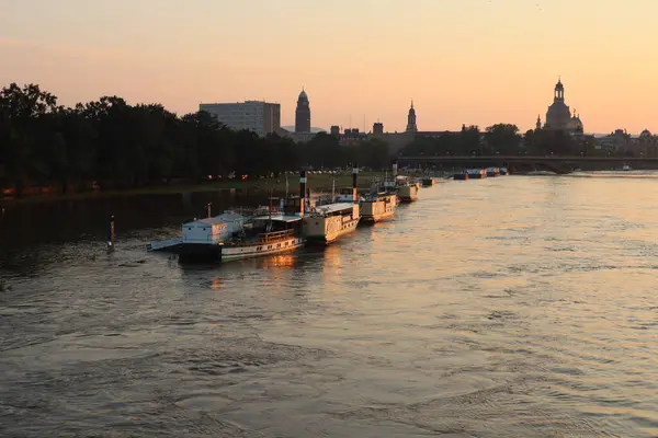 stock image DRESDEN, GERMANY - SEPTEMPER 18, 2024: Dresden city skyline with partially collapsed Carola bridge flooded at sunset from Albert bridge. High quality photo