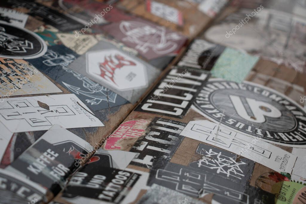 LEIPZIG, GERMANY - AUGUST 18, 2018: Abstract close-up of overlapping urban stickers and labels. High quality photo