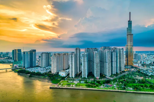 stock image Top view aerial of center Ho Chi Minh city, Vietnam, beauty skyscrapers along river urban development, transportation, energy power infrastructure. Financial, travel and business concept.