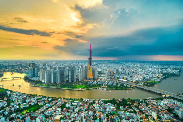 Top view aerial of center Ho Chi Minh city, Vietnam, beauty skyscrapers along river urban development, transportation, energy power infrastructure. Financial, travel and business concept.